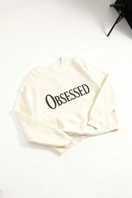 Obsessed Knitted Sweatshirt in Cream made by Petals and Peacocks