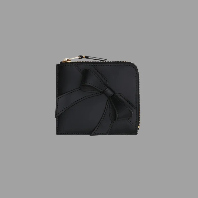Half-zip Bow Wallet sold by Plus Zero Concept Store