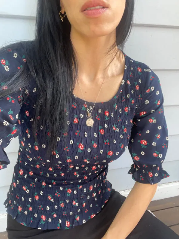 Christy Black Print Smocked Short Sleeve Top sold by All the Wild Roses