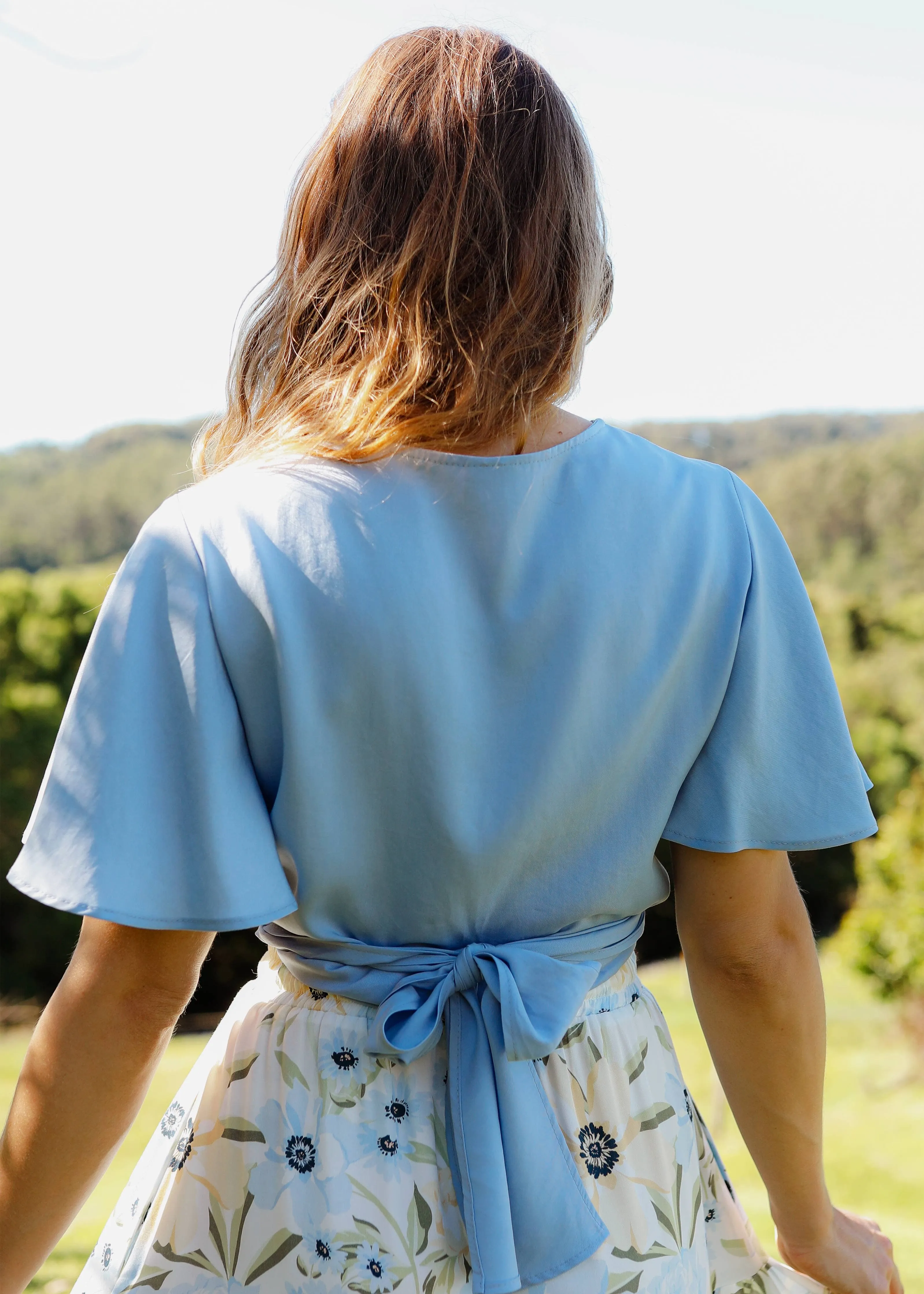 The Flora Wrap Blouse Sky Blue sold by Tali and Tasi product image thumbnail 4