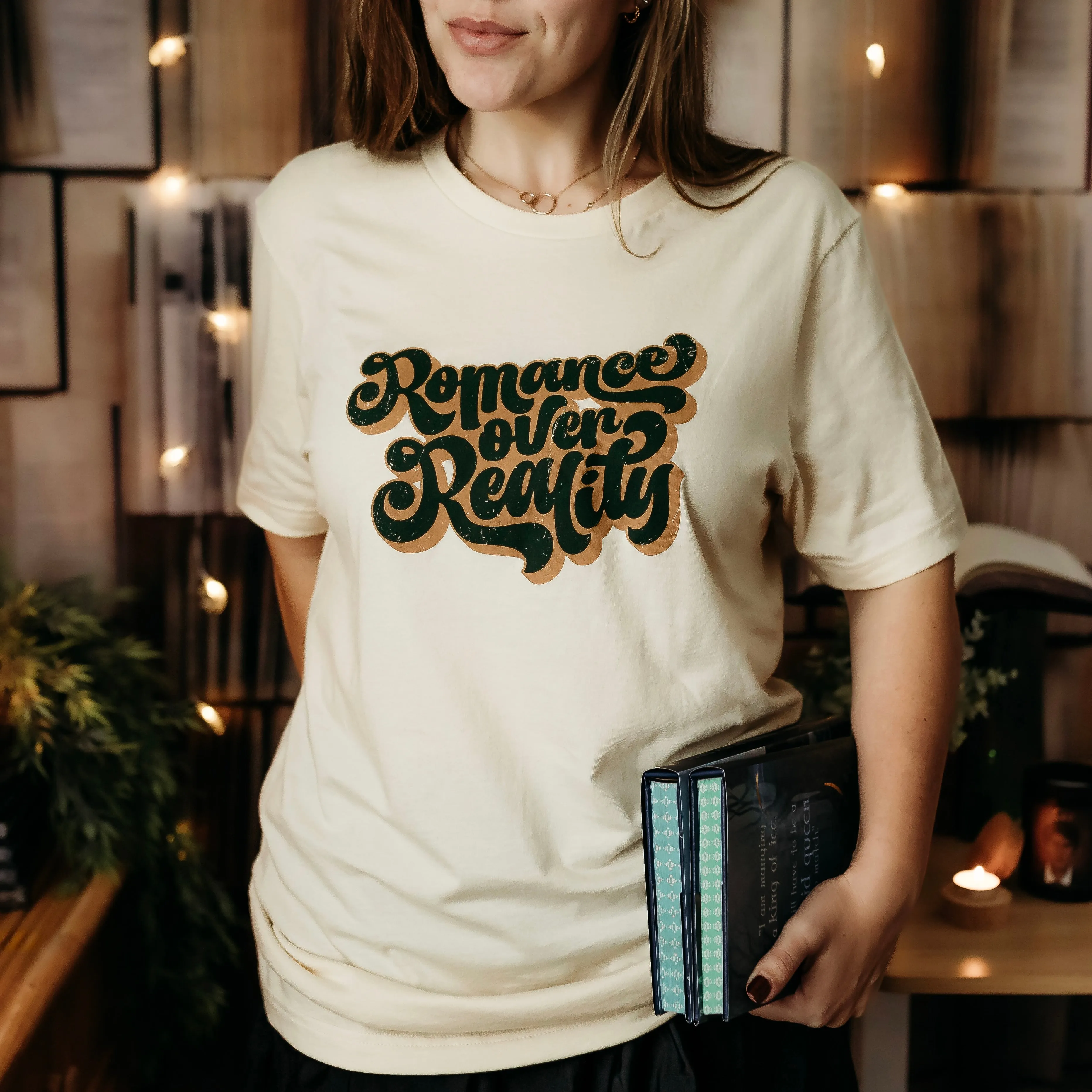 Romance Over Reality Tee sold by The Bookish Box