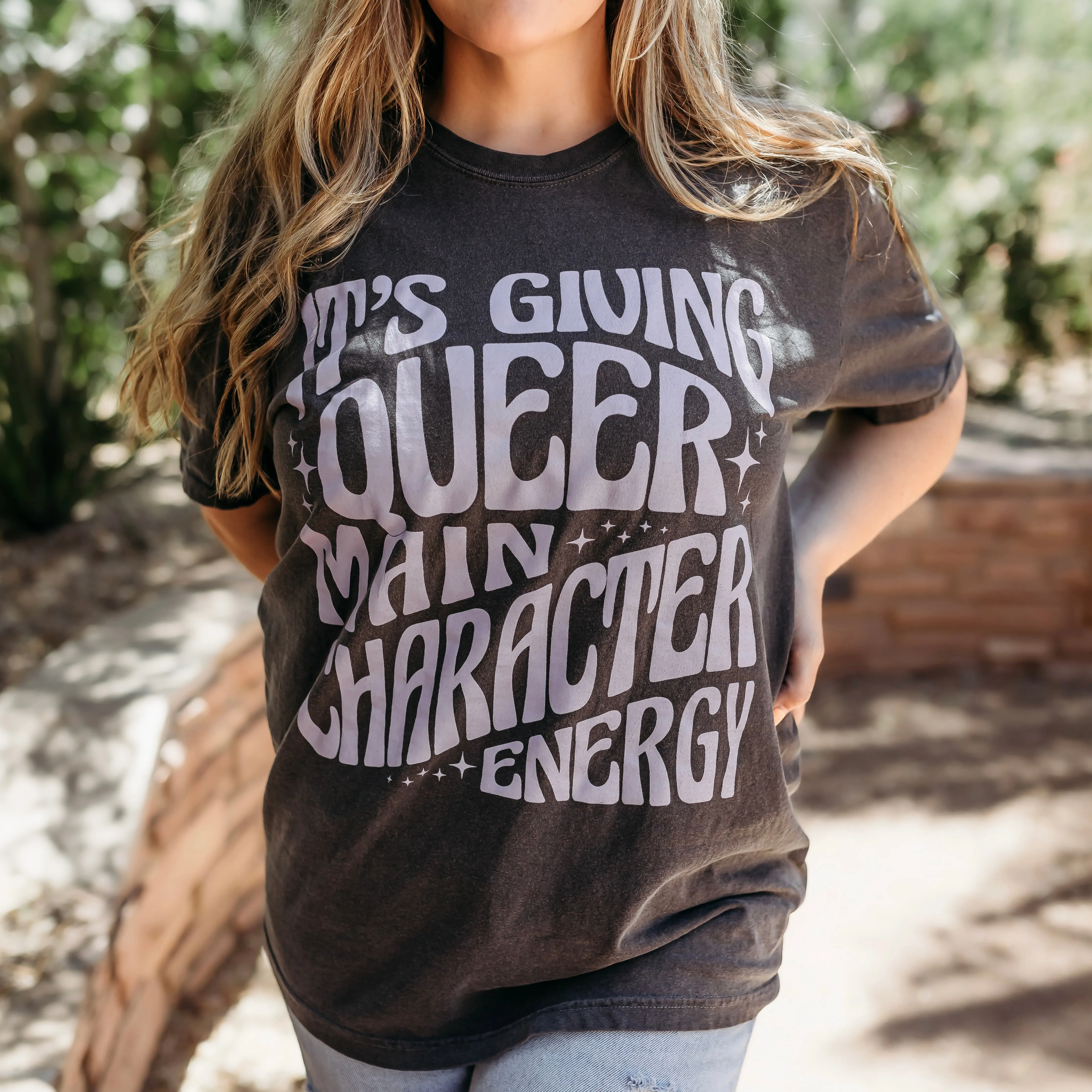 Queer Main Character Energy Heavy Weight Tee sold by The Bookish Box