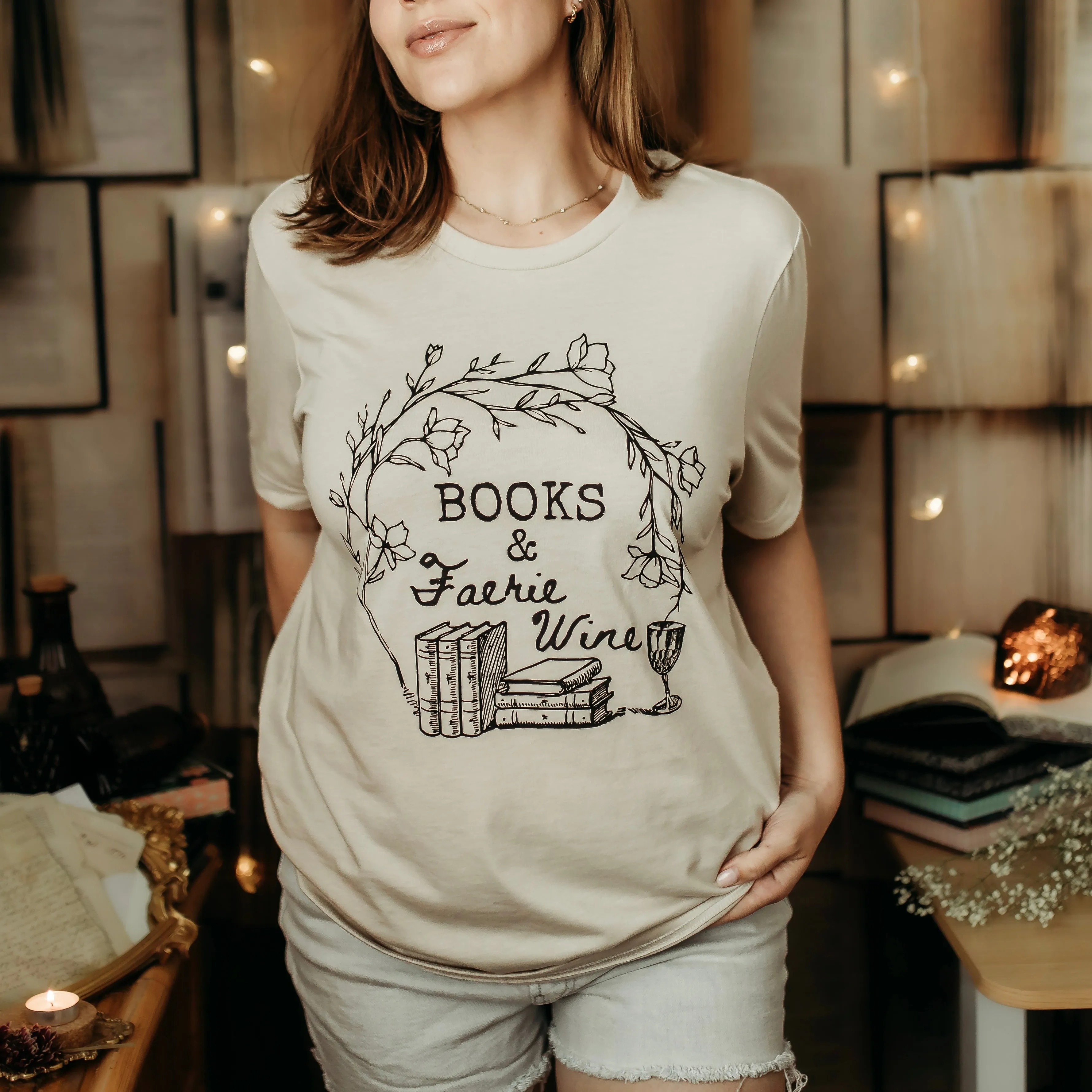 Books and Faerie Wine Tee sold by The Bookish Box