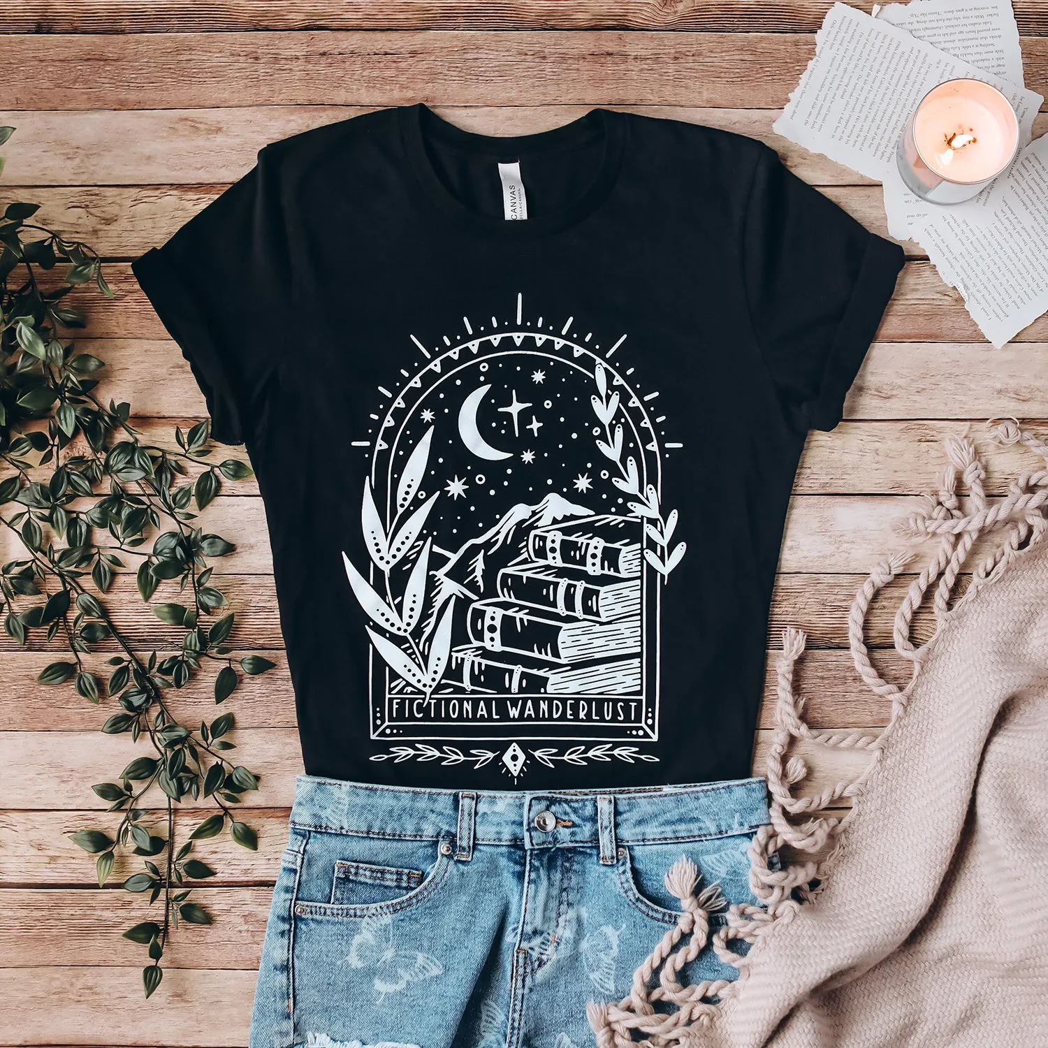 Fictional Wanderlust Tee sold by The Bookish Box