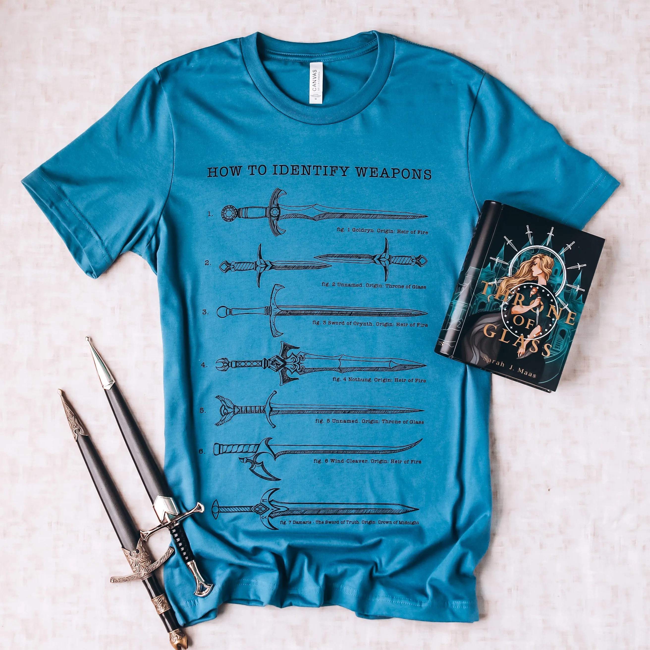 Throne of Glass Inspired: Weapons Tee sold by The Bookish Box product image thumbnail 3