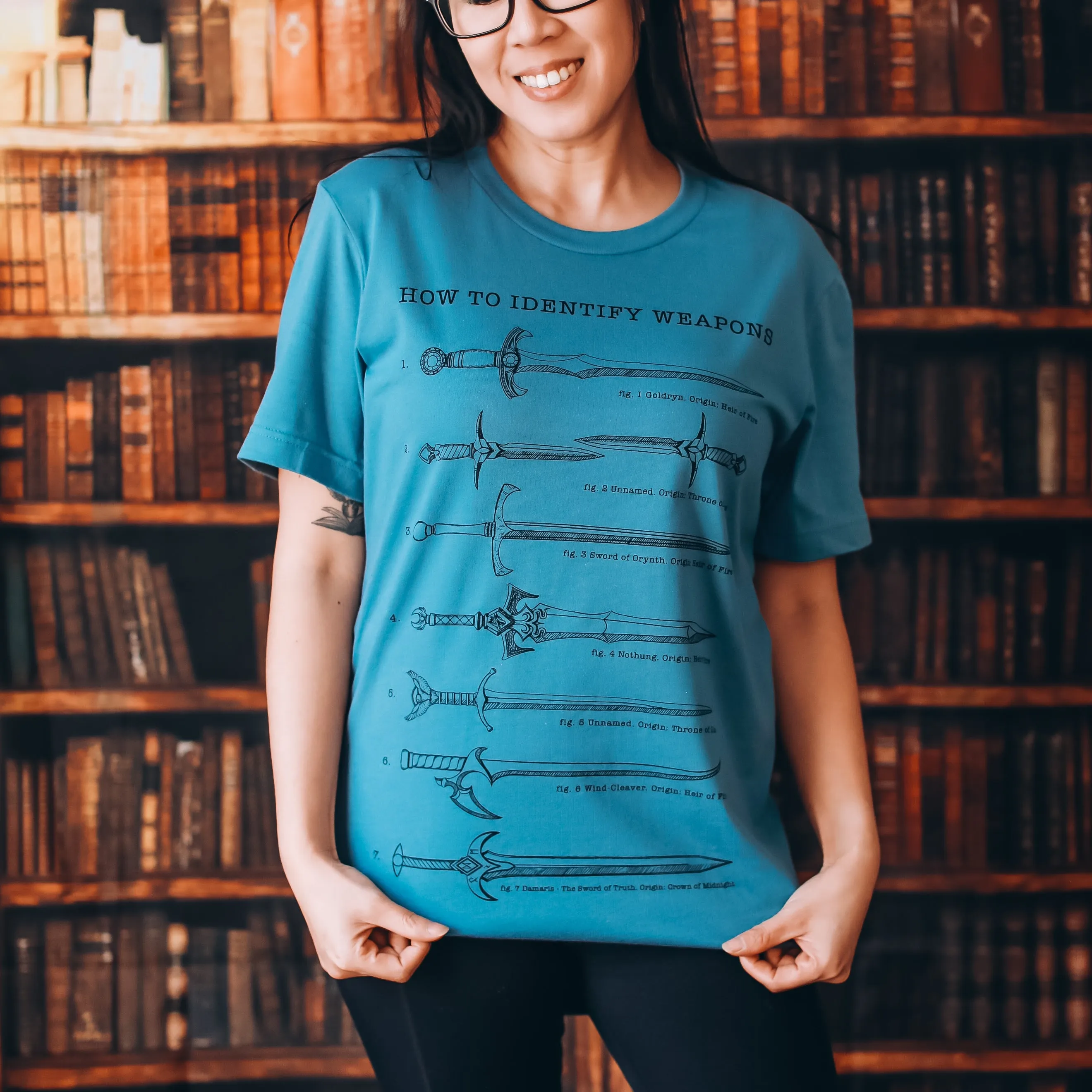 Throne of Glass Inspired: Weapons Tee sold by The Bookish Box