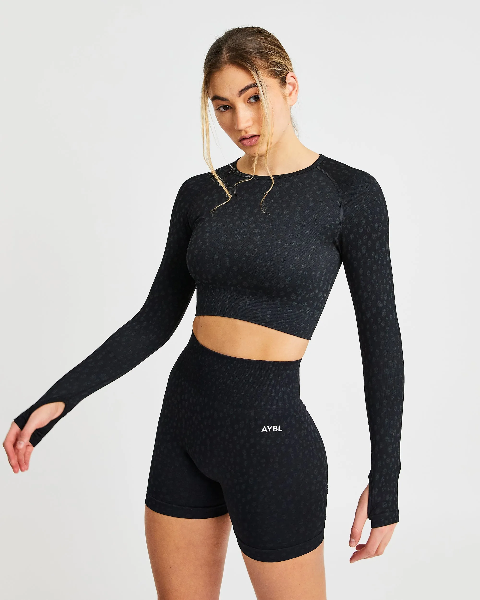 Evolve Speckle Seamless Long Sleeve Crop Top - Black sold by AYBL