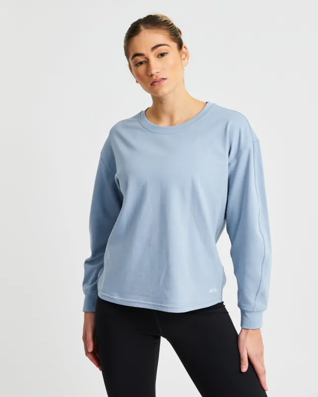 Essence Drawcord Jumper - Washed Blue made by AYBL