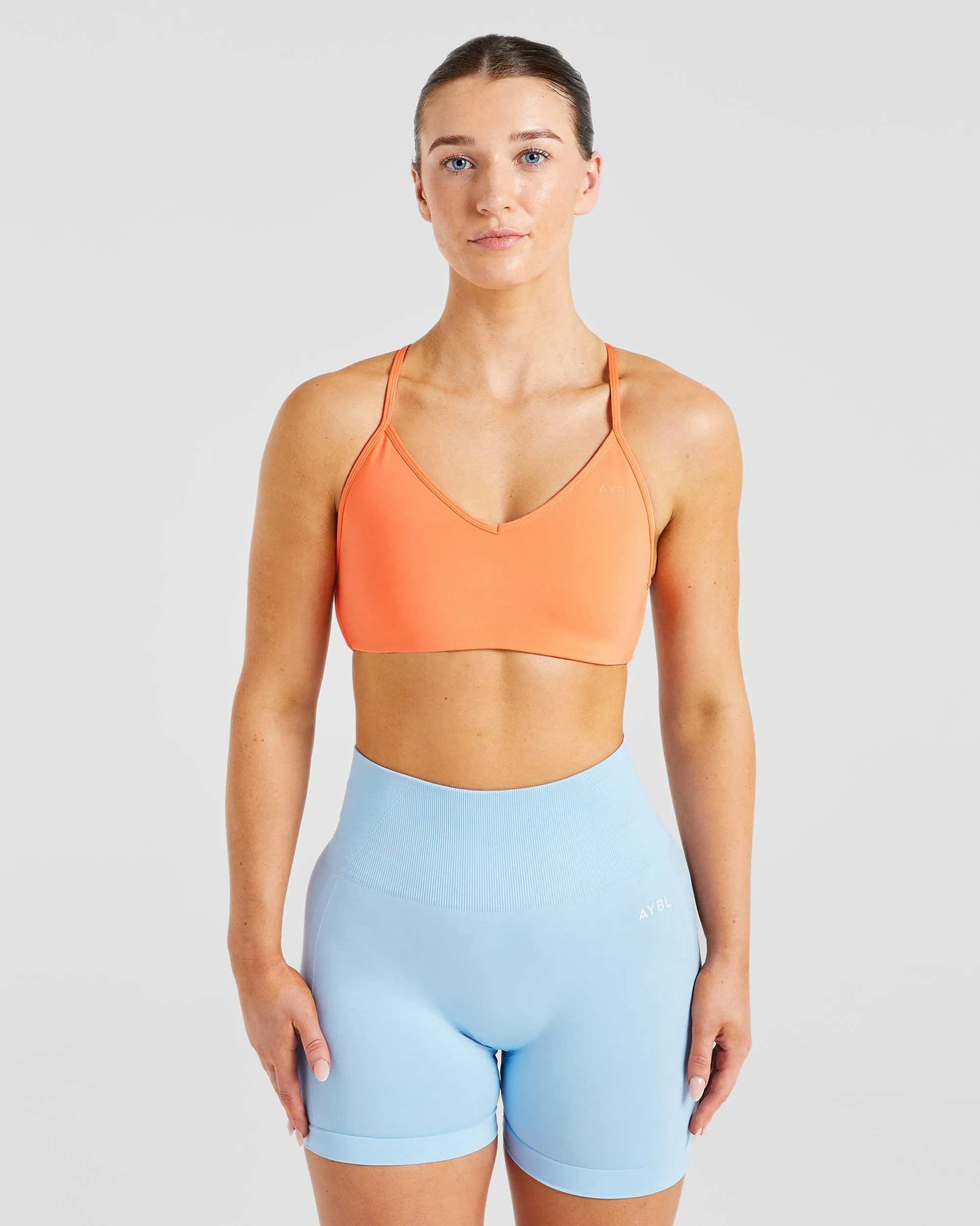 Essential Crossback Sports Bra - Papaya Orange sold by AYBL