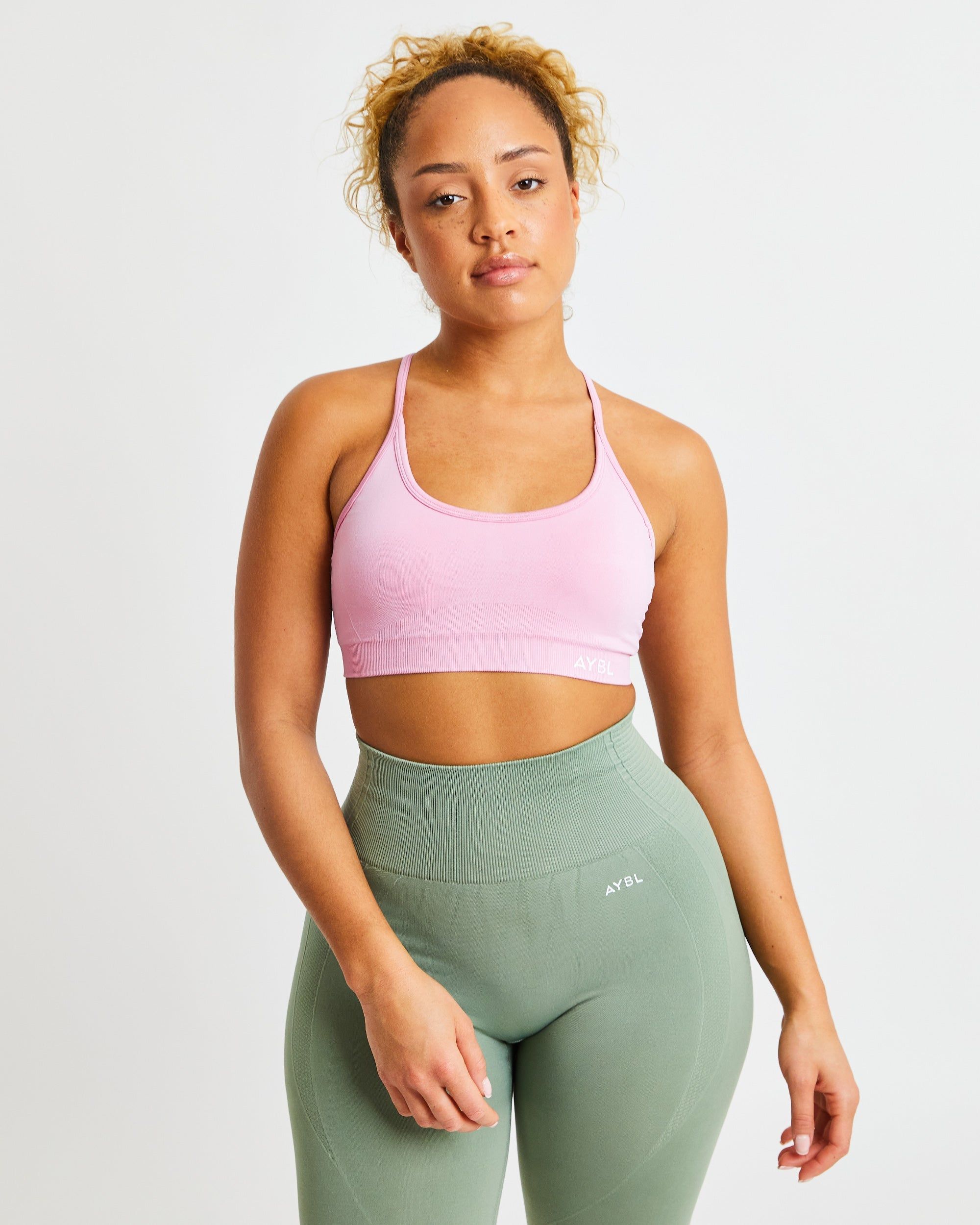 Essential Seamless V Neck Sports Bra - Baby Pink sold by AYBL