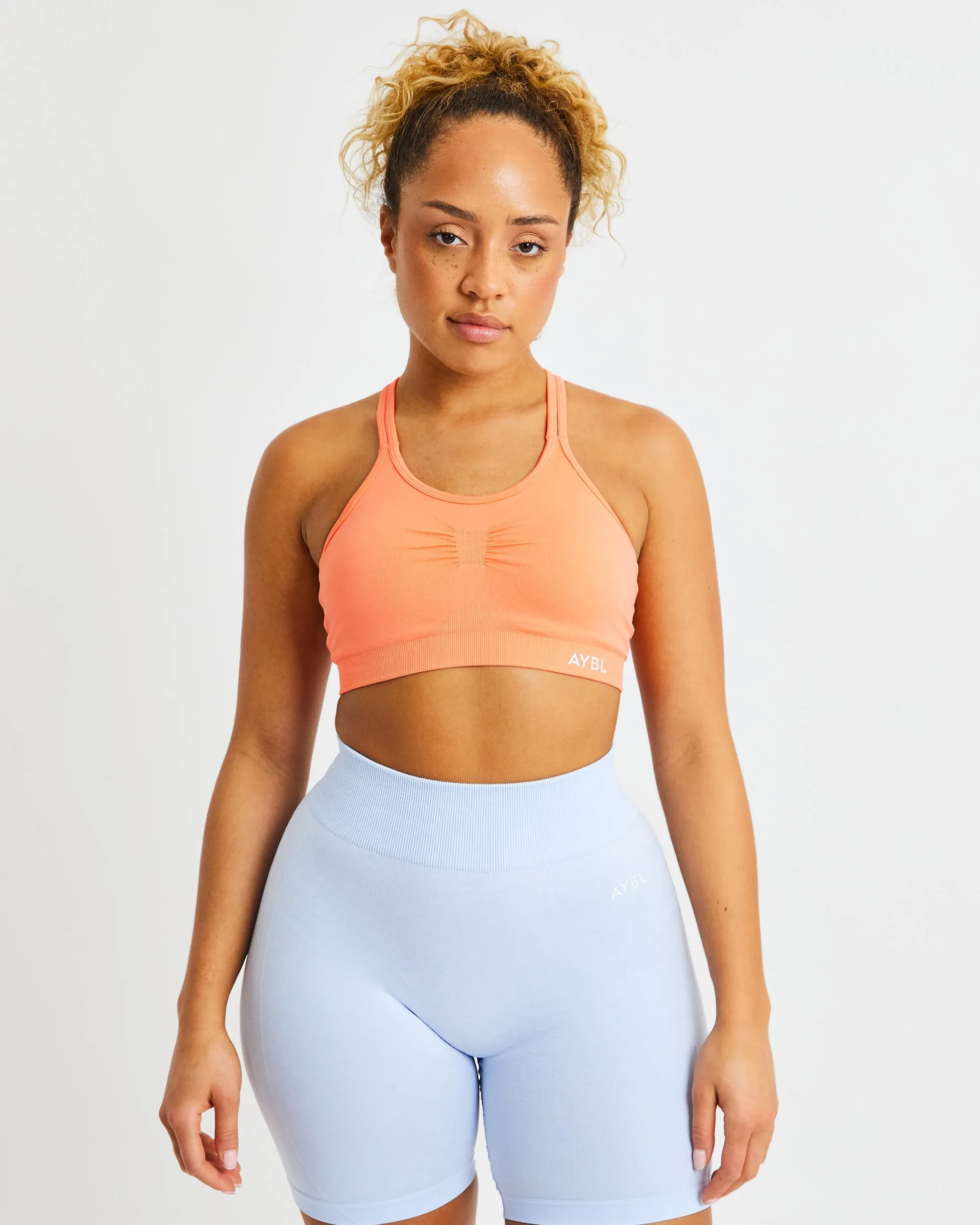 Essential Seamless Ruched Sports Bra - Sweet Peach sold by AYBL