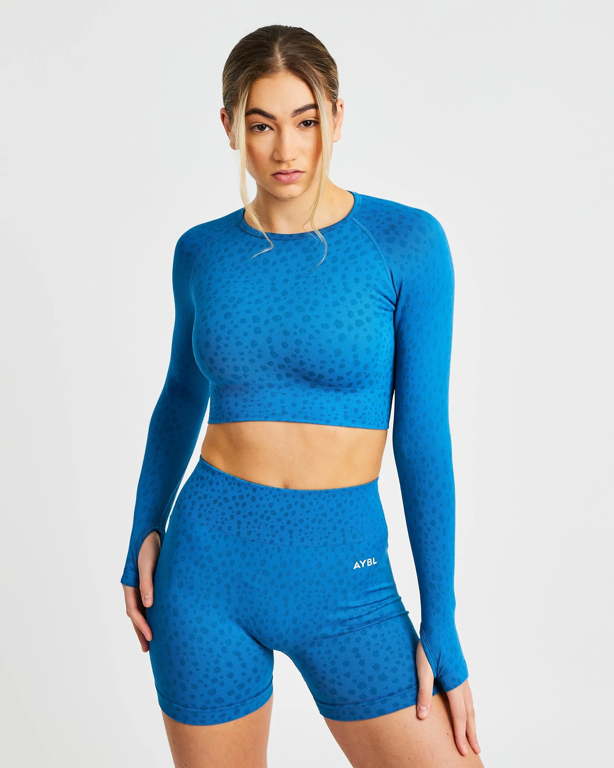Evolve Speckle Seamless Long Sleeve Crop Top - Blue sold by AYBL