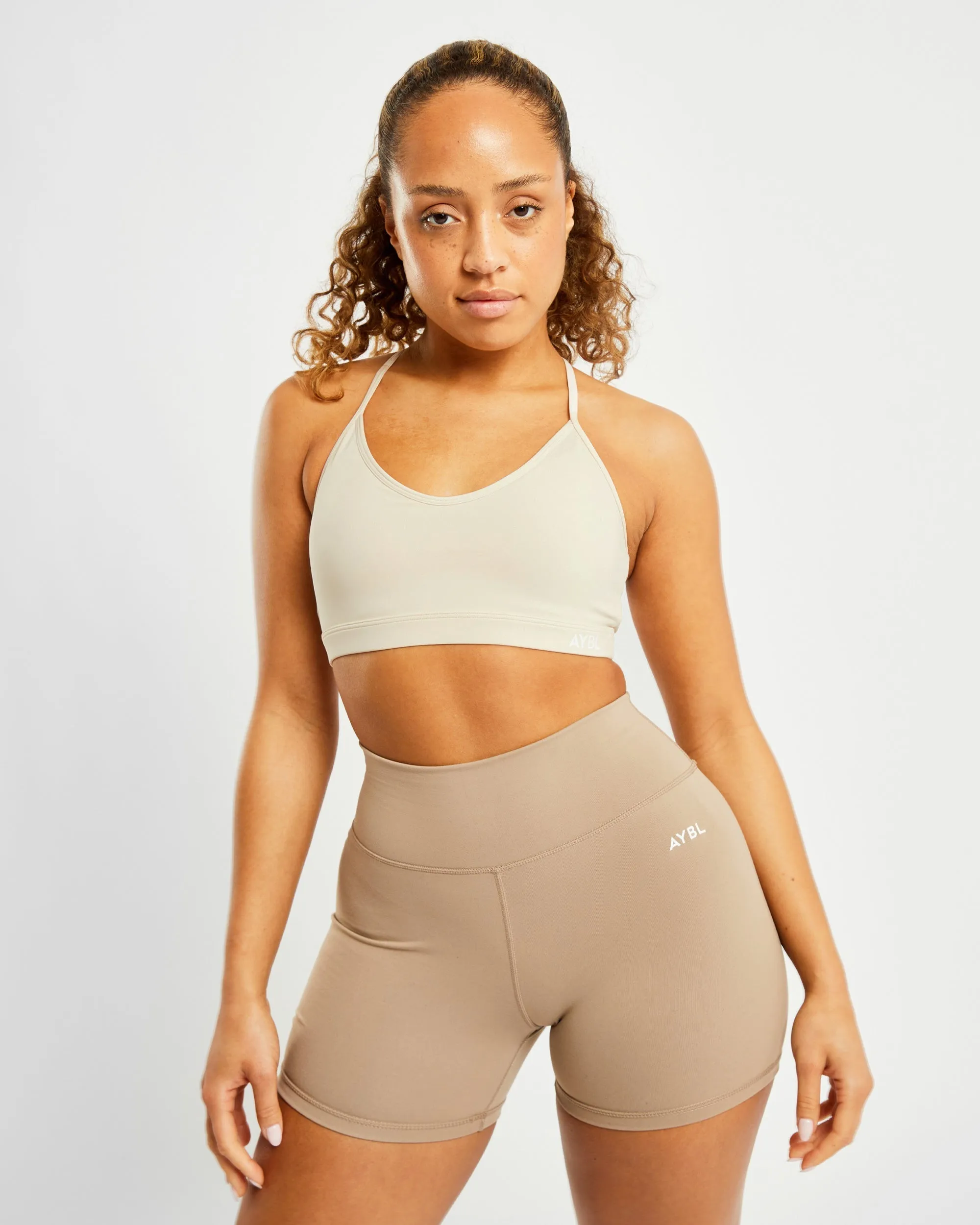 Essential V Neck Sports Bra - Beige sold by AYBL