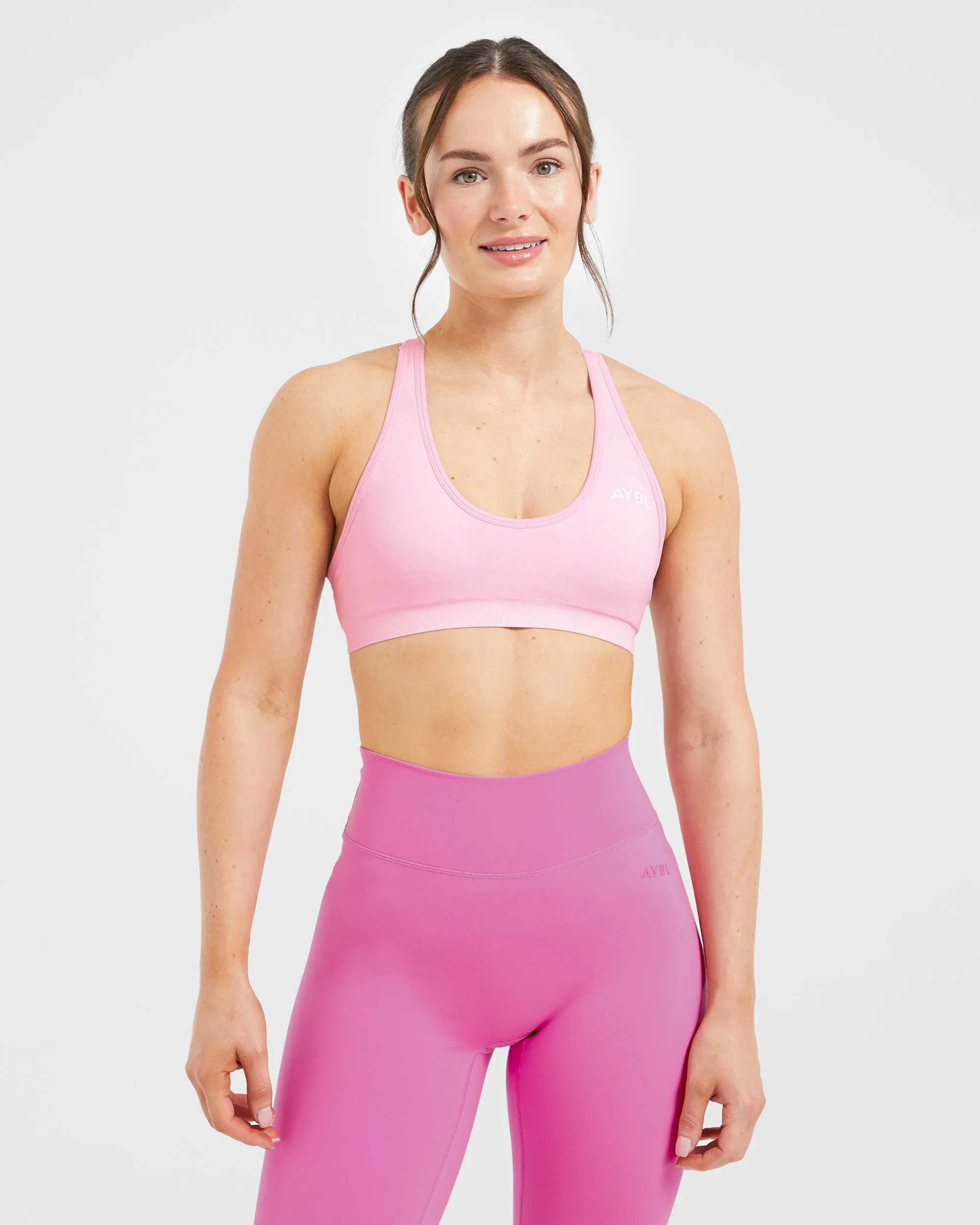 Essential Seamless Racer Back Sports Bra - Baby Pink sold by AYBL