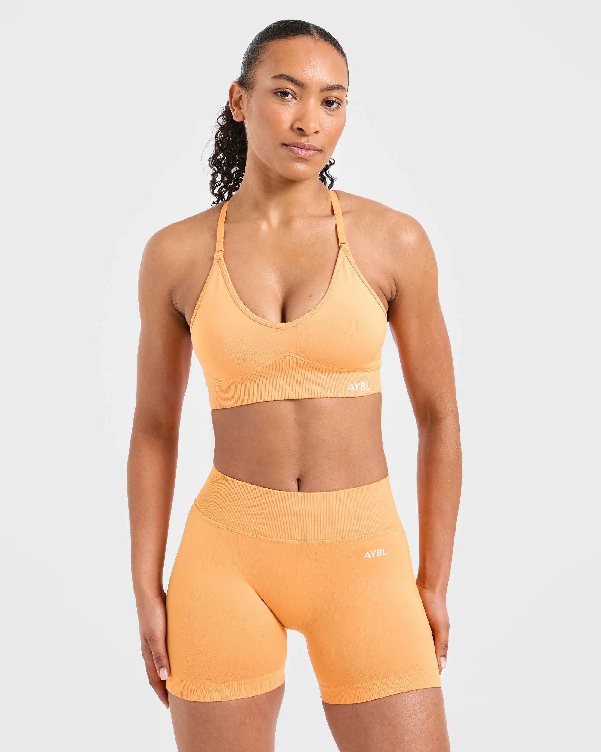 Adapt Seamless Sports Bra - Bright Orange sold by AYBL