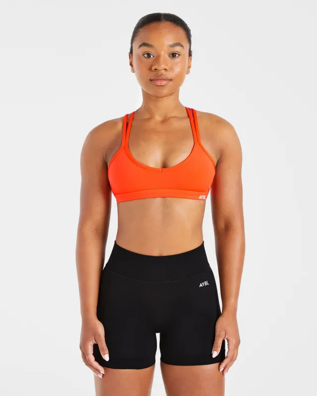Essential Strappy Sports Bra - Bright Orange sold by AYBL