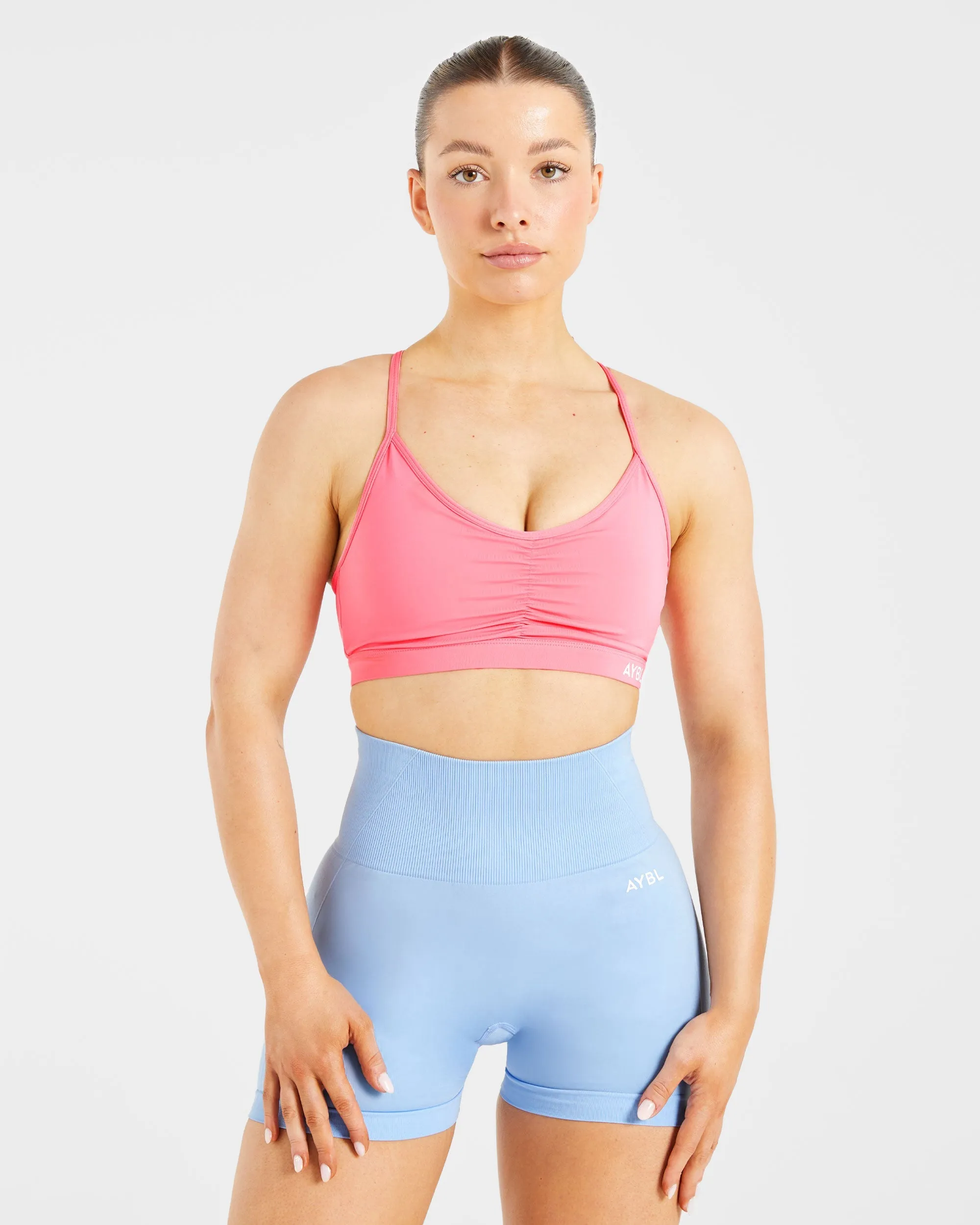 Essential Ruched Sports Bra - Coral Pink sold by AYBL