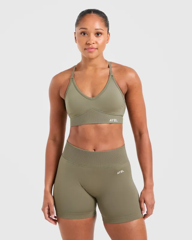 Adapt Seamless Sports Bra - Muted Olive sold by AYBL