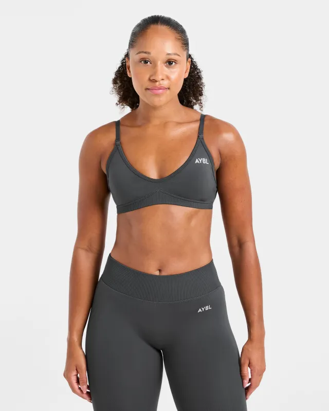 Adapt Seamless Strappy Sports Bra - Dark Charcoal sold by AYBL