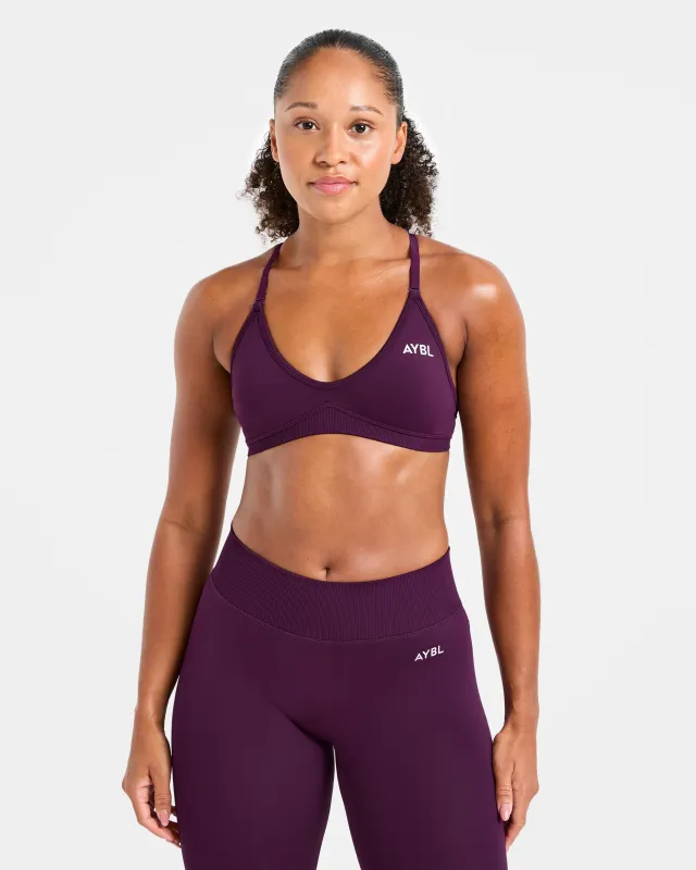 Adapt Seamless Strappy Sports Bra - Midnight Plum sold by AYBL
