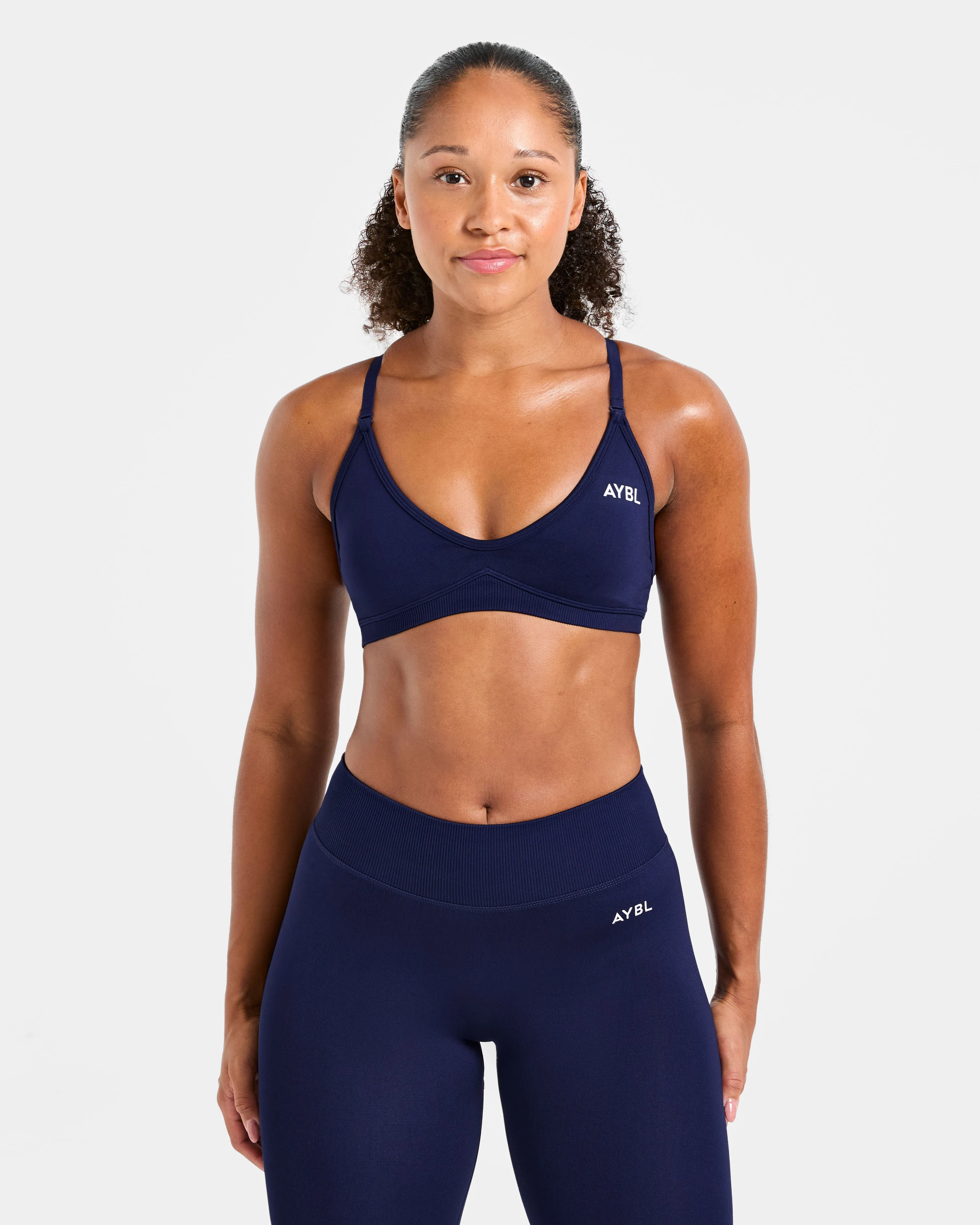 Adapt Seamless Strappy Sports Bra - Deep Navy sold by AYBL