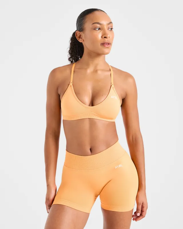 Adapt Seamless Strappy Sports Bra - Bright Orange sold by AYBL