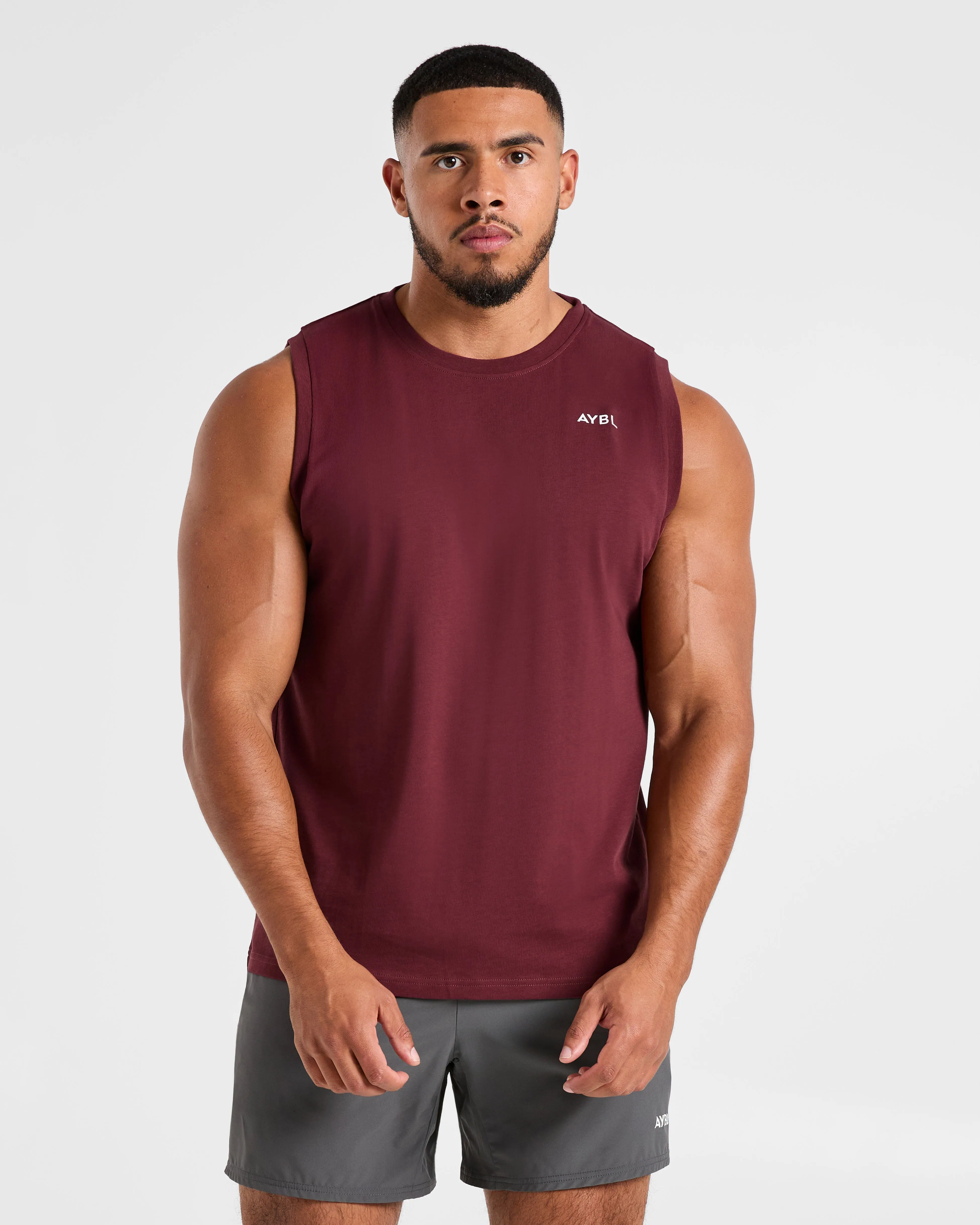 Essential Tank - Port Red sold by AYBL