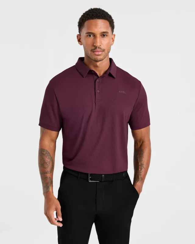 Precision Polo - Plum sold by AYBL