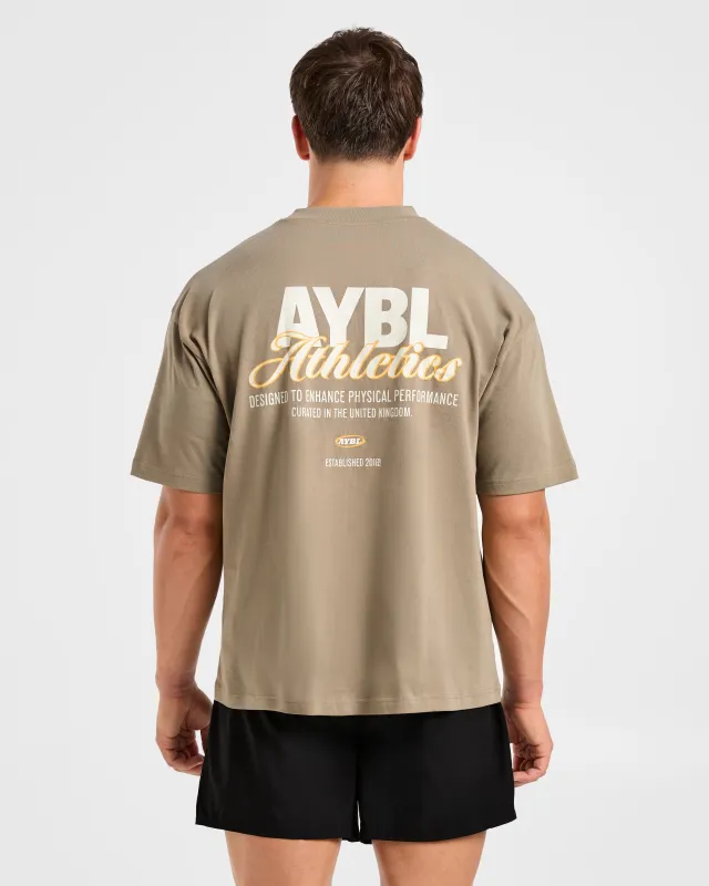 Athletics Script Oversized T Shirt - Olive Sand sold by AYBL