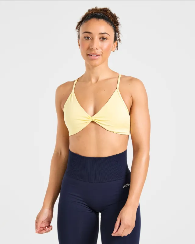Essential Twist Crossback Sports Bra - Yellow sold by AYBL