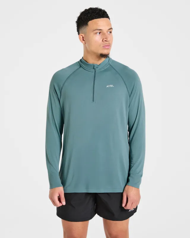 Attain Seamless 1/2 Zip Pullover - Titan Blue made by AYBL