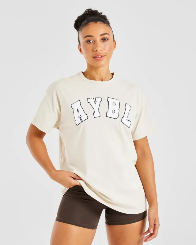 Varsity Fluffy Oversized T Shirt - Sand sold by AYBL