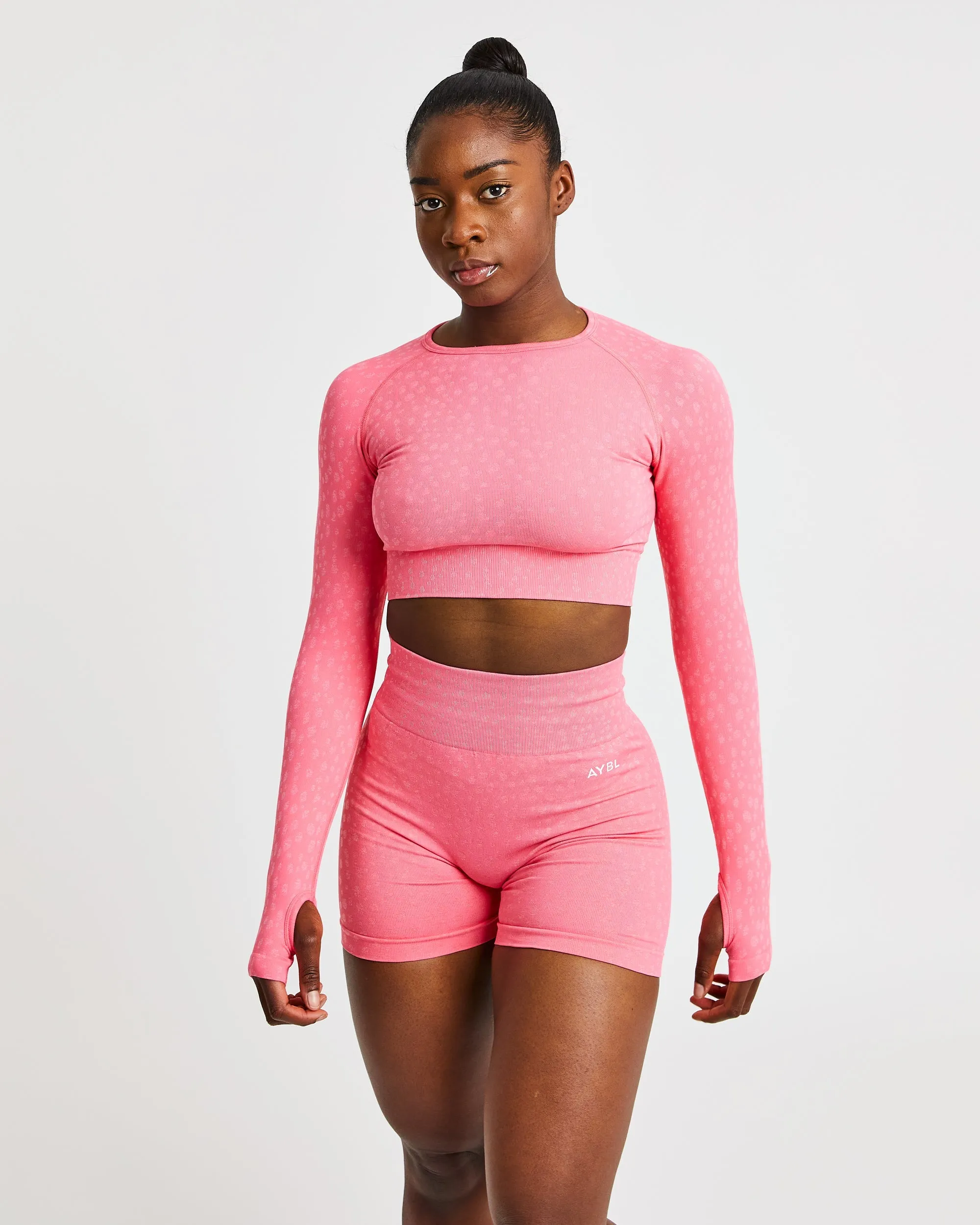 Evolve Speckle Seamless Long Sleeve Crop Top - Coral Pink sold by AYBL