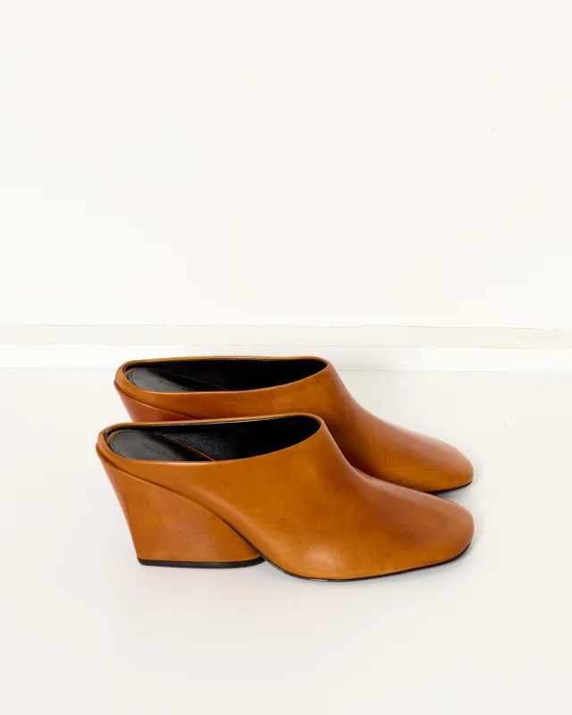 Slant Mules Ochre sold by French + Italian