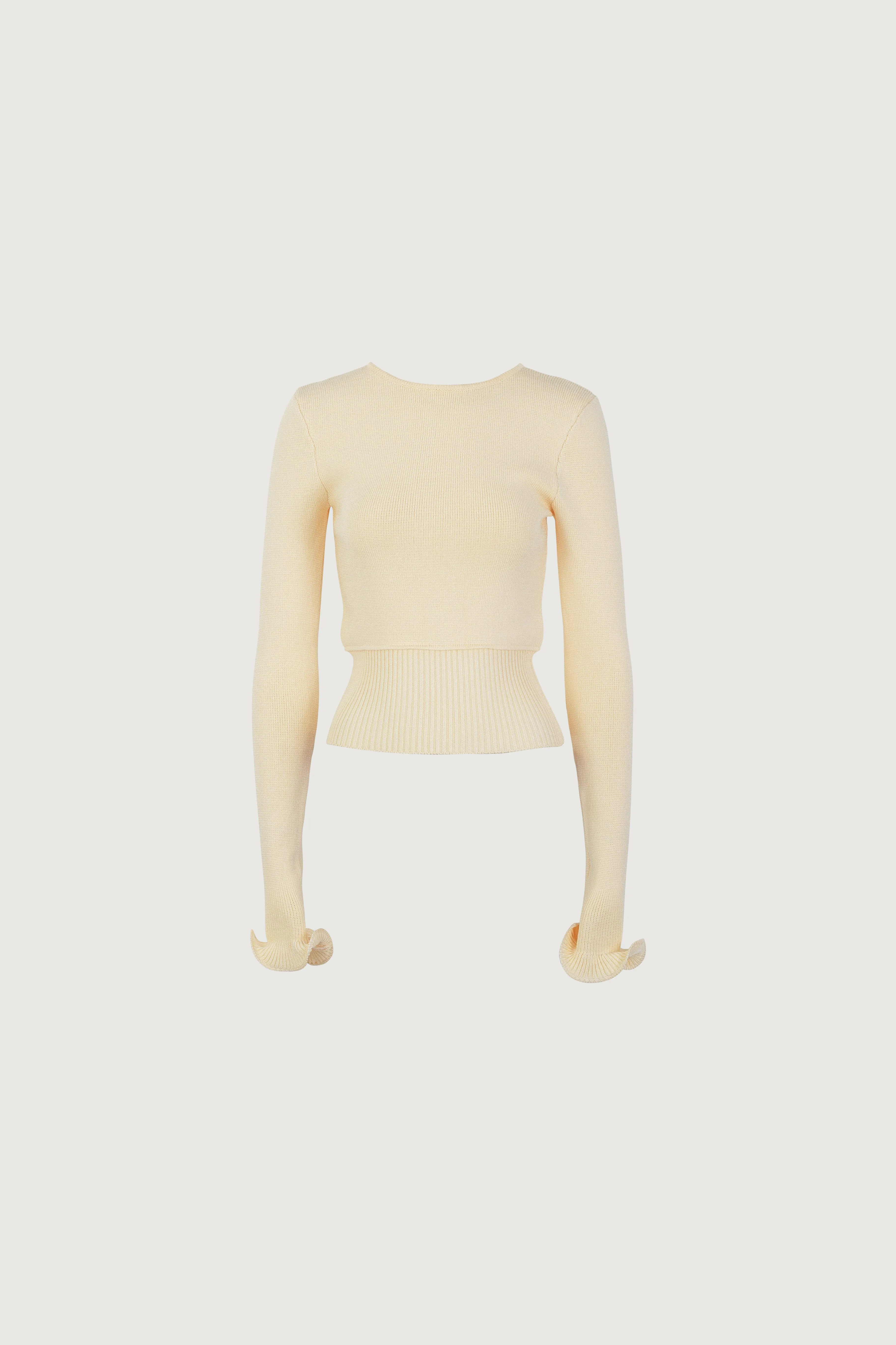 Ruffle Hem Sweater (Cream) sold by SAME