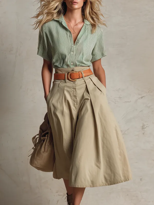 A retro-style casually elegant ensemble a Western-inspired green woven striped shirt paired with a khaki cotton skirt made by Oyrosy