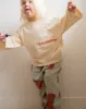 tomato joggers sold by Kindly