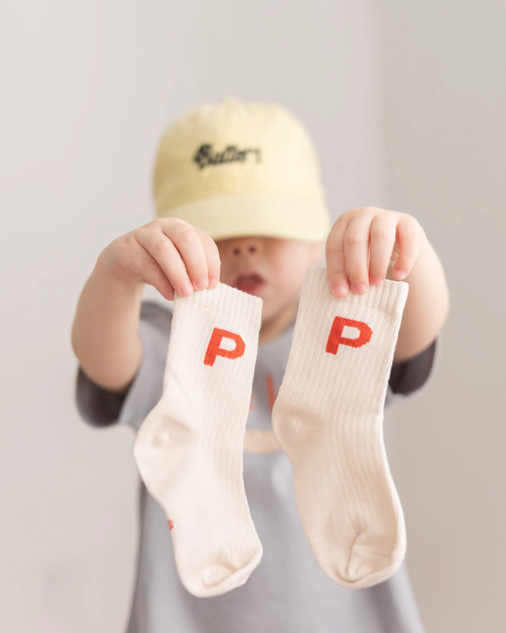 p is for please socks sold by Kindly