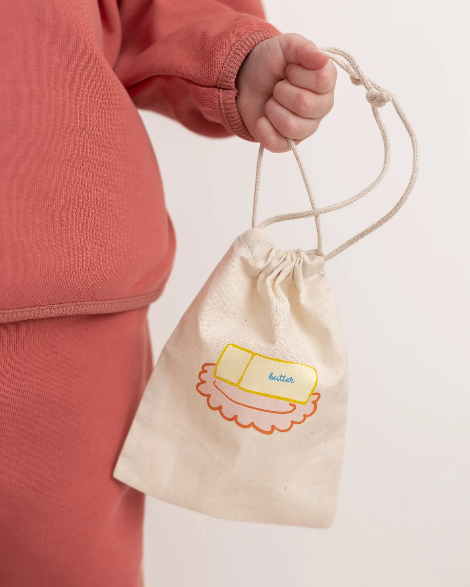 butter drawstring bag sold by Kindly