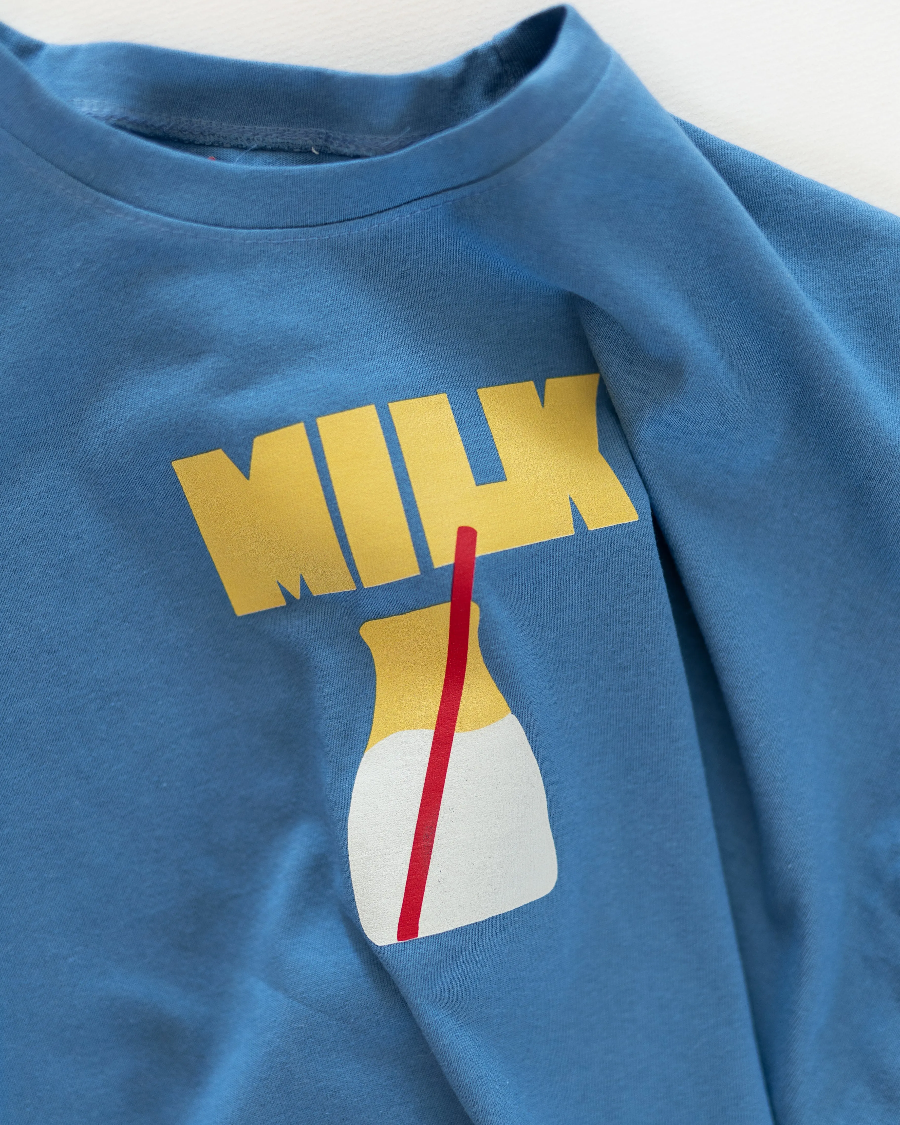 blue milk tee sold by Kindly