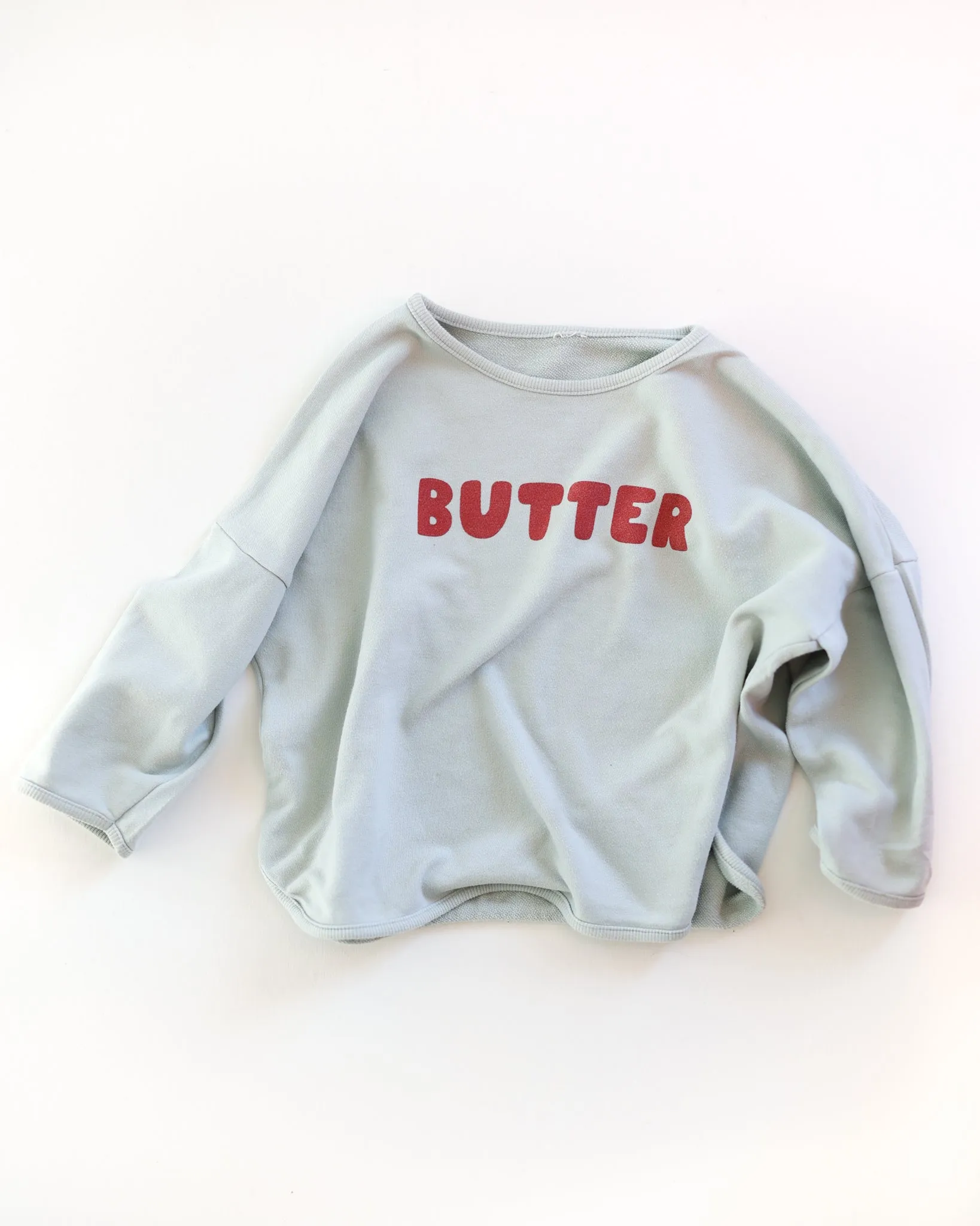 butter sweatshirt sold by Kindly