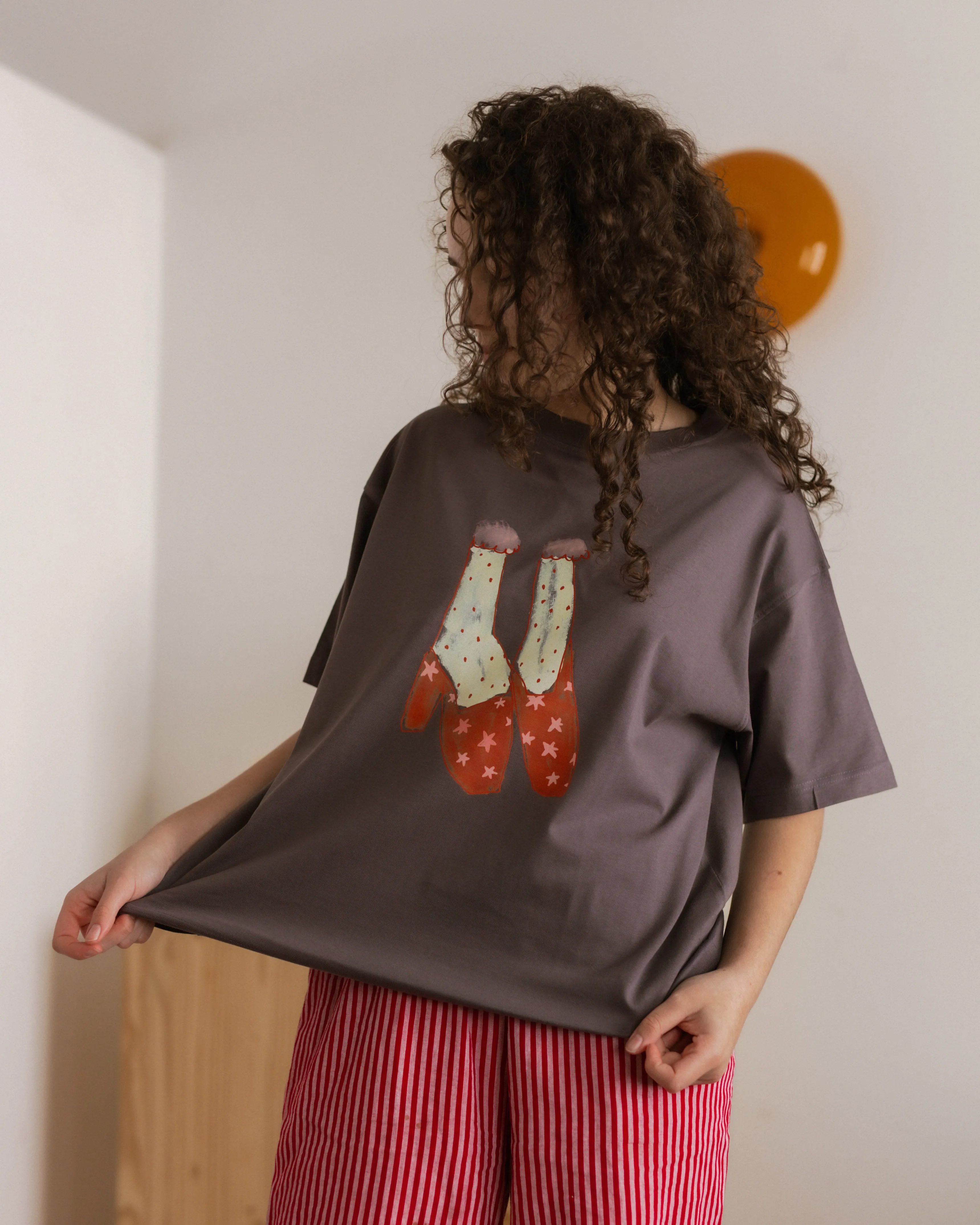 woman's starry heels tee sold by Kindly