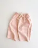 pink gingham cropped pants sold by Kindly