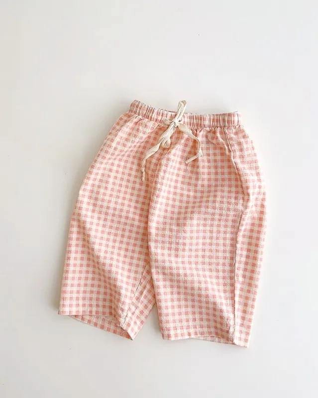pink gingham cropped pants sold by Kindly