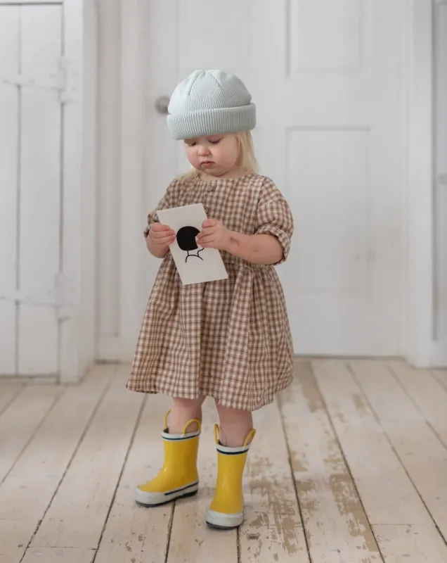 gingham rain girl dress sold by Kindly