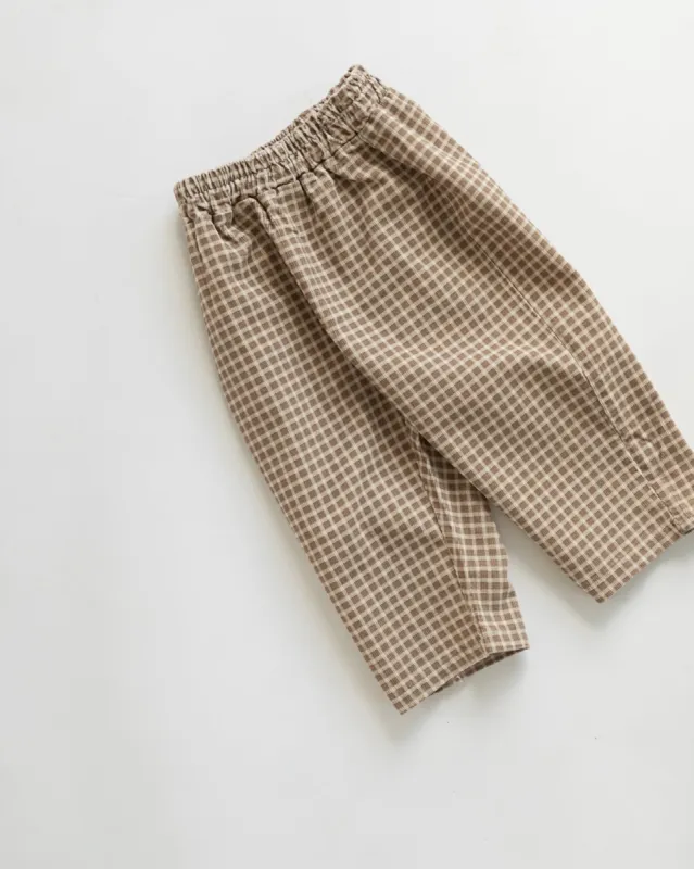 checked pants sold by Kindly