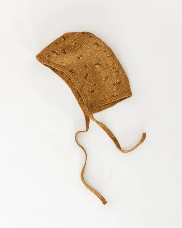 flower hat sold by Kindly