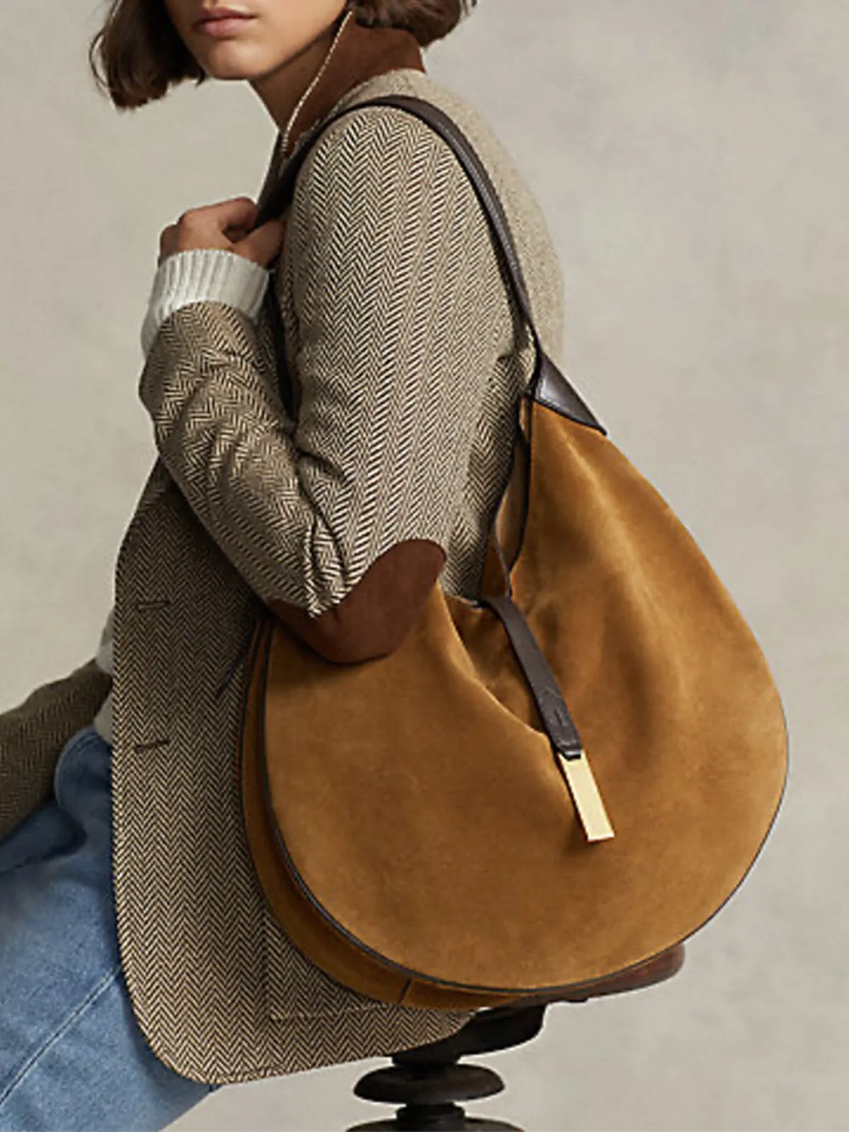 Curved Buckle Shoulder Bag sold by Aha Selected