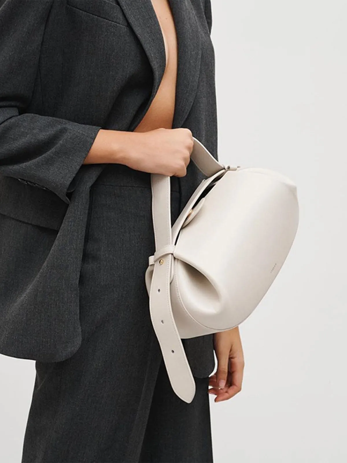 Buckle PU Oval Handbag sold by Aha Selected