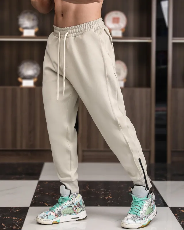 Track Side Sweatpants With Zipper Hem sold by Aha Selected